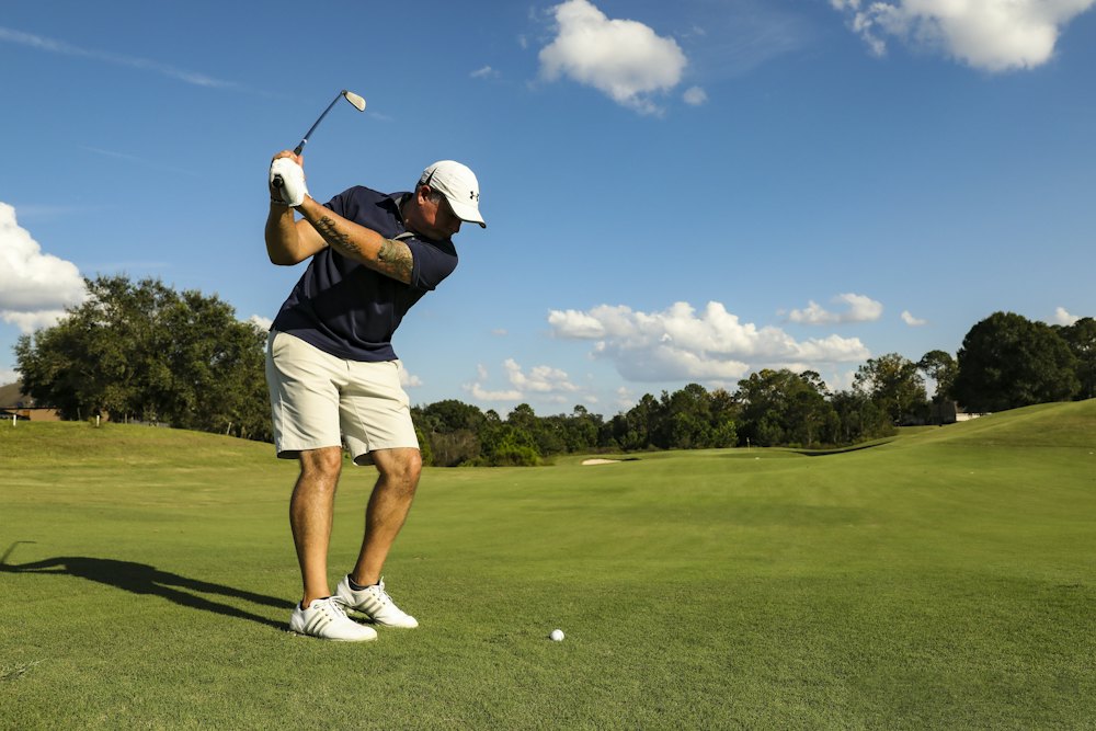 Tariq Hayat at the top of his backswing on a sunny fairway